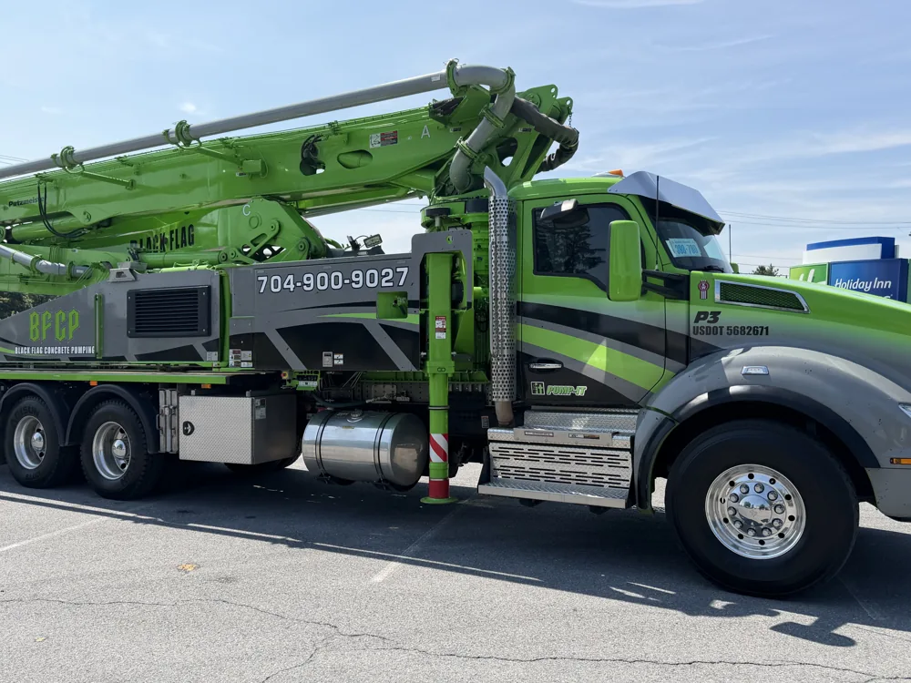 Black Flag's green and black concrete pump truck